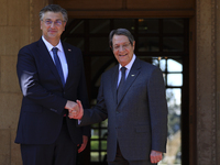 Cyprus' president Nicos Anastasiades, left, shakes hands with Croatian Prime Minister Andrej Plenkovic before their meeting at the president...
