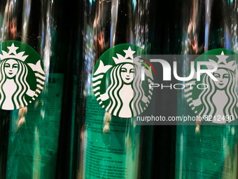 Reusabkle Starbucks bottles are seen in Starbucks Coffee shop in Krakow, Poland on April 29, 2022. (