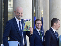 French National Education Minister Jean-Michel Blanquer (L) and show the book « Les Fables de la Fontaines » , French Minister for European...