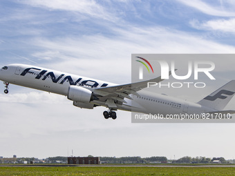 Finnair Airbus A350-900 aircraft as seen during rotation, take off and fly phase as the plane is departing from Amsterdam Schiphol Airport A...
