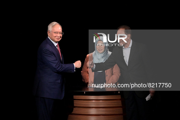 Malaysia's former prime minister Najib Razak debates with opposition leader Anwar Ibrahim in Kuala Lumpur, Malaysia, on May 12, 2022. 