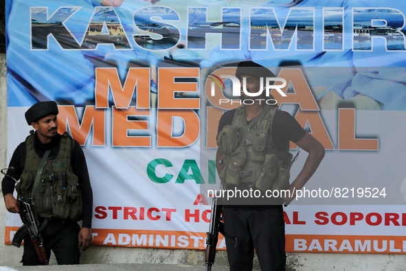 Indian army soldier smiles as they stand alert during LG Manoj Sinha's visit to Sopore, District Baramulla Jammu and Kashmir India on 13 May...
