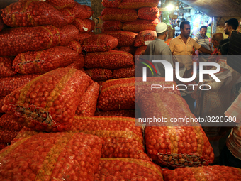 Bangladeshi onion seller waits for customer in a wholesale market during the countrywide strike at Kawran Bazar in Dhaka, Bangladesh. May 13...