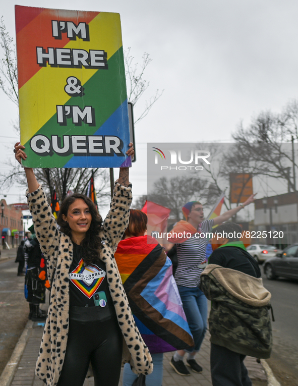 An activist holds a placard with words 'I'm Here and I'm Queer'.More than 100 local LGBTQ2S + supporters gathered Friday evening at the sou...