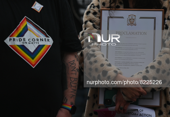An activist holds the Proclamation of Edmonton Mayor Amarjeet Sohi.
More than 100 local LGBTQ2S + supporters gathered Friday evening at the...