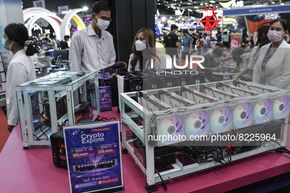Visitors inspect crypto mining equipment at the Thailand Crypto Expo in Bangkok, Thailand, 14 May 2022. 