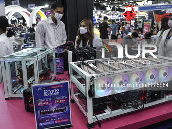 Visitors inspect crypto mining equipment at the Thailand Crypto Expo in Bangkok, Thailand, 14 May 2022. (