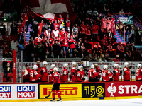 Team swiss bench after goal  with spectators in the back 
Team Swiss 
Team Italy 
©IIHF2022  during the Ice Hockey World Championship - S...