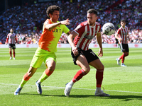 Jack Robinson of Sheffield United shields the ball from Brennan Johnson of Nottingham Forest during the Sky Bet Championship Play-Off Semi-...