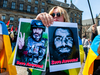 The Ukrainian community in The Netherlands gathered at the Dam square in Amsterdam to demand the extraction of the Ukrainian soldiers trappe...