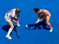 Maria Granatto (R) of Argentina competes for the ball with Maria Lopez of Spain during the FIH Hockey Pro League Women game between Spain an...