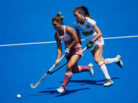 Agustina Gorzelany (L) of Argentina competes for the ball with Florencia Amundson of Spain during the FIH Hockey Pro League Women game betwe...