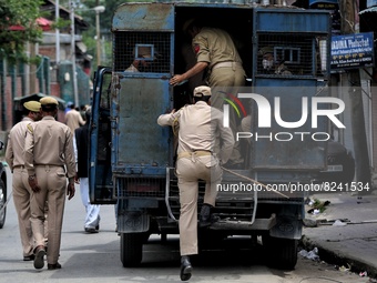 Jammu and Kashmir Police Cops enter a vehicle after a protest which was organised by BJP in Baramulla, Jammu and kashmir, India on 15 May 20...