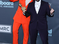 Dan Smyers and Shay Mooney of Dan + Shay pose with the Top Country Duo/Group award in the press room at the 2022 Billboard Music Awards held...