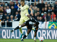 Allan Saint-Maximin of Newcastle United and Martin Odegaard of Arsenal in action during the Premier League match between Newcastle United an...