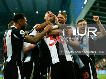  Callum Wilson of Newcastle United celebrates with teammates after scoring their sides first goal during the Premier League match between Ne...
