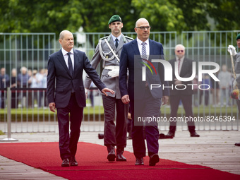 German Chancellor Olaf Scholz (L) and Prime Minister of Liechtenstein Daniel Risch (R) review the guard of honour at the Chancellery in Berl...
