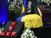 Relatives of Ukrainian first president Leonid Kravchuk attends his funeral ceremony in Kyiv, Ukraine, May 17, 2022 (