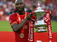 Liverpool's Sadio Mane holds  the FA Cup after their sides 6-5 penalty shoot-out after a 0-0 draw in normal time FA Cup Final between Chelse...