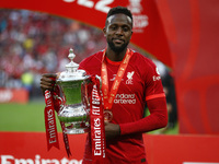 Liverpool's Divock Origiholds  the FA Cup after their sides 6-5 penalty shoot-out after a 0-0 draw in normal time FA Cup Final between Chels...