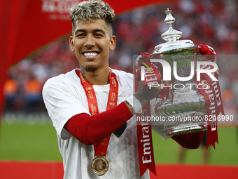 Liverpool's Roberto Firmino holds  the FA Cup after their sides 6-5 penalty shoot-out after a 0-0 draw in normal time FA Cup Final between C...