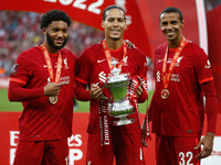 Joe Gomez, Virgil Van Dijk and Joel Matip of Liverpool with the Cup after their sides 6-5 penalty shoot-out after a 0-0 draw in normal time...