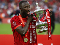 Liverpool's Sadio Mane holds  the FA Cup after their sides 6-5 penalty shoot-out after a 0-0 draw in normal time FA Cup Final between Chelse...