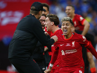Liverpool's Roberto Firmino celebrates after Liverpool's Kostas Tsimikas scoring the goal in the penalty shoot out during FA Cup Final betwe...
