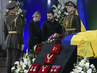 Ukraine's President Volodymyr Zelensky and his wife Olena Zelenska stay near the coffin of Ukrainian first president Leonid Kravchuk during...