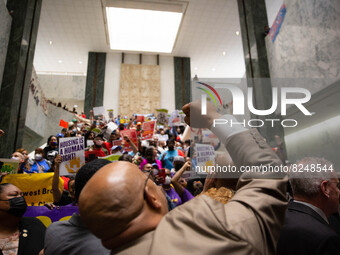 Fifty-one protesters were arrested after blocking the New York State Senate and Assembly Chambers in Albany, New York on May 17, 2022. Over...