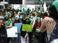
Demonstrators march through the streets during the “National Green Up and Walk Out” rally from Union Square to Washington Square Park deman...