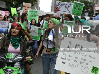 
Demonstrators march through the streets during the “National Green Up and Walk Out” rally from Union Square to Washington Square Park deman...