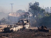 Burnt cars are seen after a fire, Limassol, Cyprus, on Jun. 2, 2021. Jordans King Abdullah II has offered to station firefighting aircraft i...