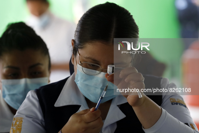 A nurse prepares the first dose of Covid19 Pfizer vaccine during mass vaccination campaign for infants 12 to 14 years of age, without comorb...