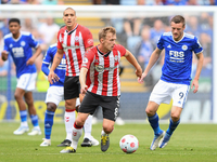 
James Ward-Prowse of Southampton under pressure from Jamie Vardy of Leicester City during the Premier League match between Leicester City a...