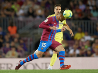 Clement Lenglet of Barcelona and Giovani Lo Celso of Villarreal compete for the ball during the LaLiga Santander match between FC Barcelona...