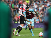 Dwight McNeil of Burnley in action with Newcastle United's Sean Longstaff  during the Premier League match between Burnley and Newcastle Uni...