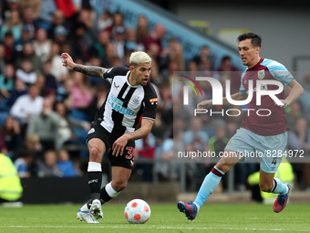 Bruno Guimaraes of Newcastle United in action with Jack Cork of Burnley  during the Premier League match between Burnley and Newcastle Unite...
