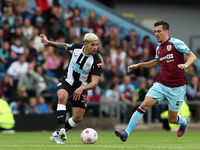 Bruno Guimaraes of Newcastle United in action with Jack Cork of Burnley  during the Premier League match between Burnley and Newcastle Unite...