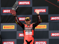 Spanish Alvaro Bautista of Aruba.It Racing - Ducati poses with the second place trophy after the Race 2 of the FIM Superbike World Champions...