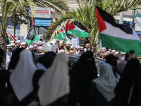 Protestors wave Palestinian flags while chanting anti-Israeli slogans during a protest against a march by Jewish ultranationalists through e...