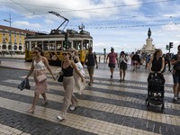 People are seen walking along one of the avenues near Praça de Comercio. Lisbon, May 23, 2022. Portugal is the European Union country with t...