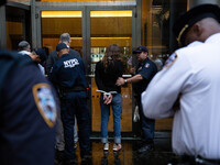 Fourteen demonstrators were arrested outside of BlackRock on May 25, 2022 after blockading the entrance during the corporation’s annual shar...