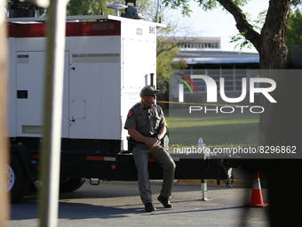 An officer is seen in front Robb Elementary School in Uvalde, Texas, May 25, 2022. (