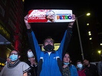 People gather in the streets to follow the election results of the progressive coalition Pacto Histórico with Gustavo Petro for president an...