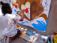 Several artists transform the facade of a Malasaña local in the seventh edition of Pinta Malasaña, on 29 May, 2022 in Madrid, Spain. This ev...