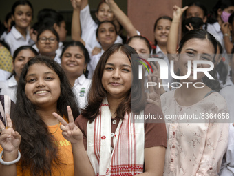 Students of St. Mary's English High School celebrate after their student Ashlesha Sarma (M) stood 7th rank in the HSLC class 10 examination,...