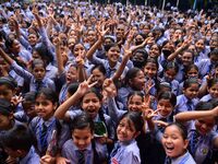 Students celebrate their success after HSLC class 10 examination results were declared, at Christjyoti school in Nagaon district of Assam ,I...