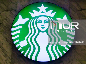 Starbucks logo is seen on a coffee shop at the railway station in Warsaw, Poland on June 2nd, 2022. (