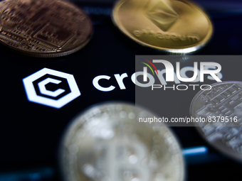 Cronos logo displayed on a phone screen and representation of cryptocurrencies are seen in this illustration photo taken in Krakow, Poland o...